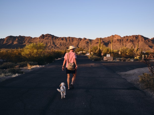 Wayne and Polly on a Walk with Mountains in Background at Sunset