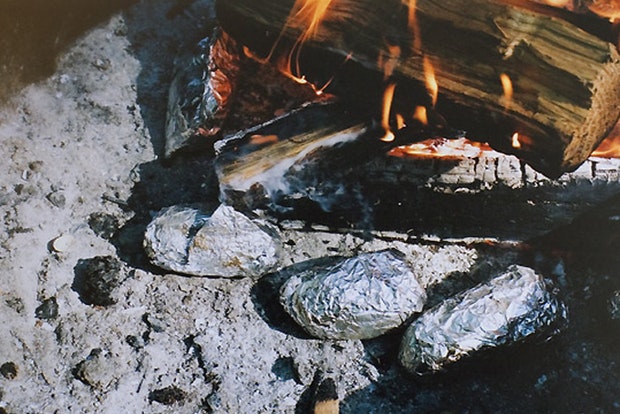 Foil-wrapped Baked Potatoes in a Campfire
