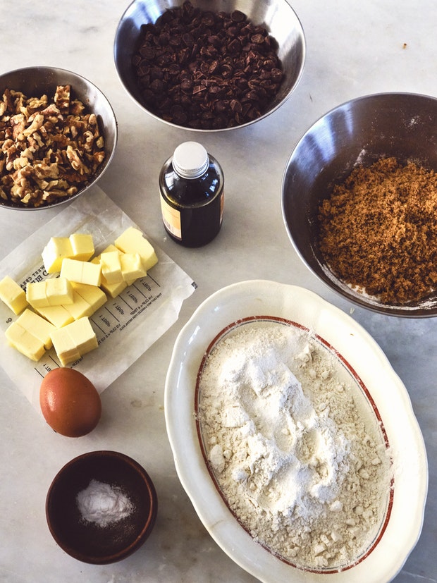 Ingredients for great chocolate chip cookies arranged in bowls”   border=