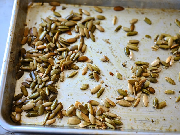 pepitas toasted on a baking sheet