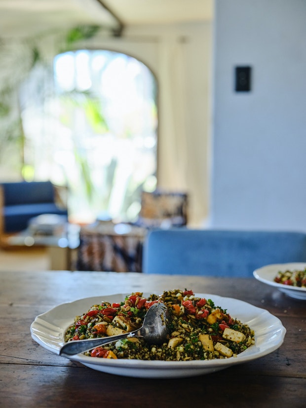 Big plate of quinoa with tomatoes, pesto, and pepitas