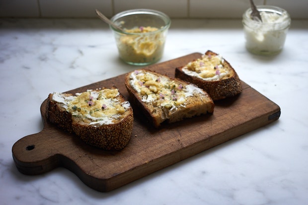 lemon chutney smeared on sourdough toast on a kitchen counter