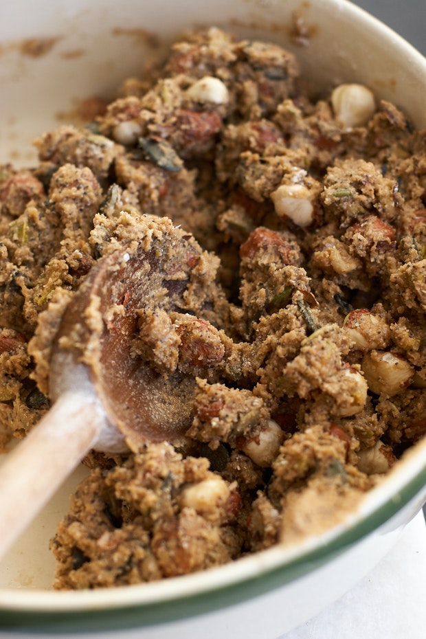 dough mixed with seeds and nuts to make biscotti in a large bowl