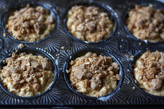 muffin batter in muffin tin before baking