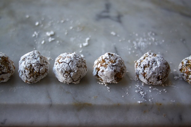 small pistachio cookies (biscotti) on marble counter