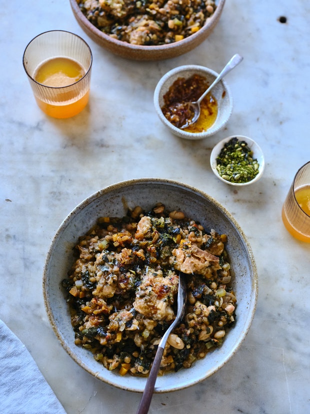Ribollita, a beautifully thick Tuscan stew with dark greens, lots of beans, vegetables, olive oil, and thickened with day-old bread
