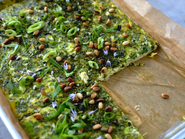 sheetpan frittata in a parchment lined baking sheet