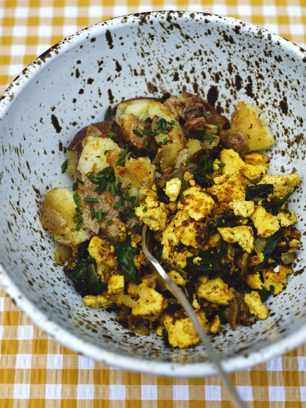 tofu scramble in a bowl with skillet potatoes