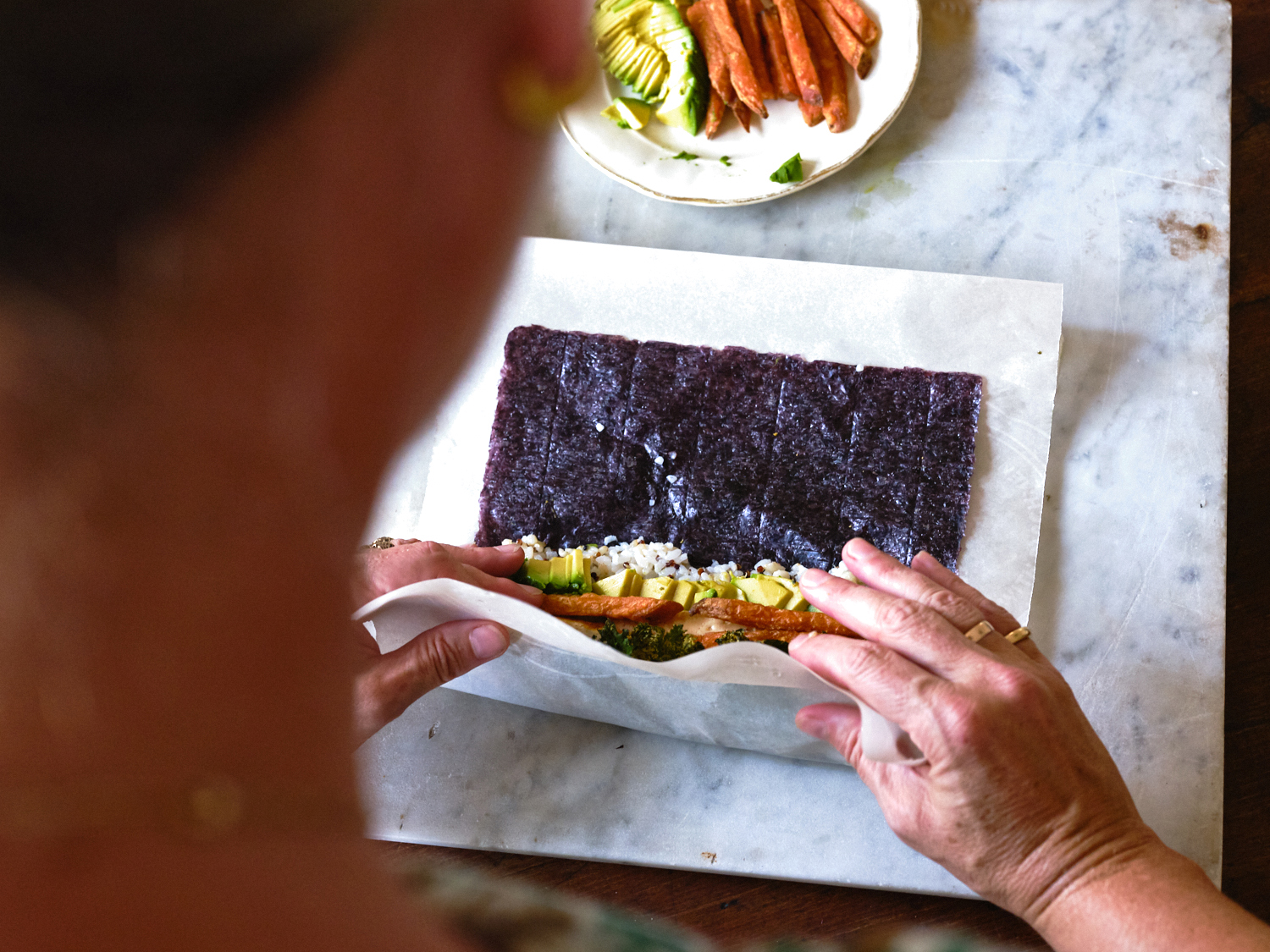 Demonstrating Sushi Tuck-and-Roll Technique