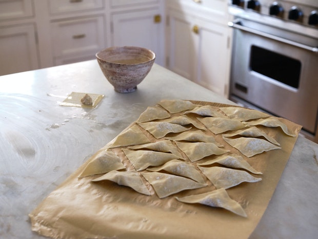 Preparing Wontons and arranging on Parchment-lined Surface