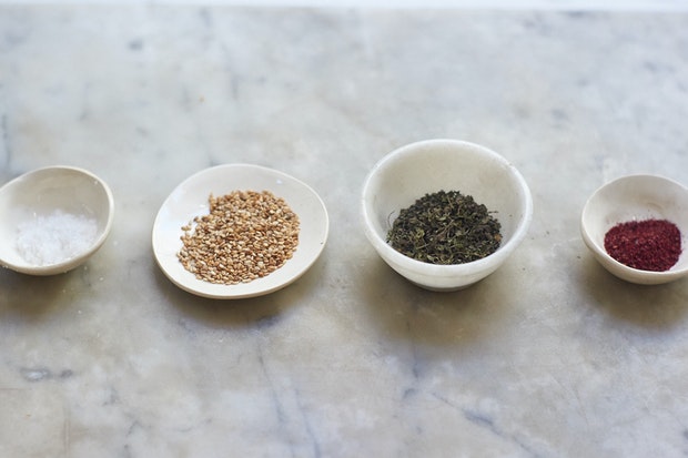 individual ingredients for making za'atar in small bowls